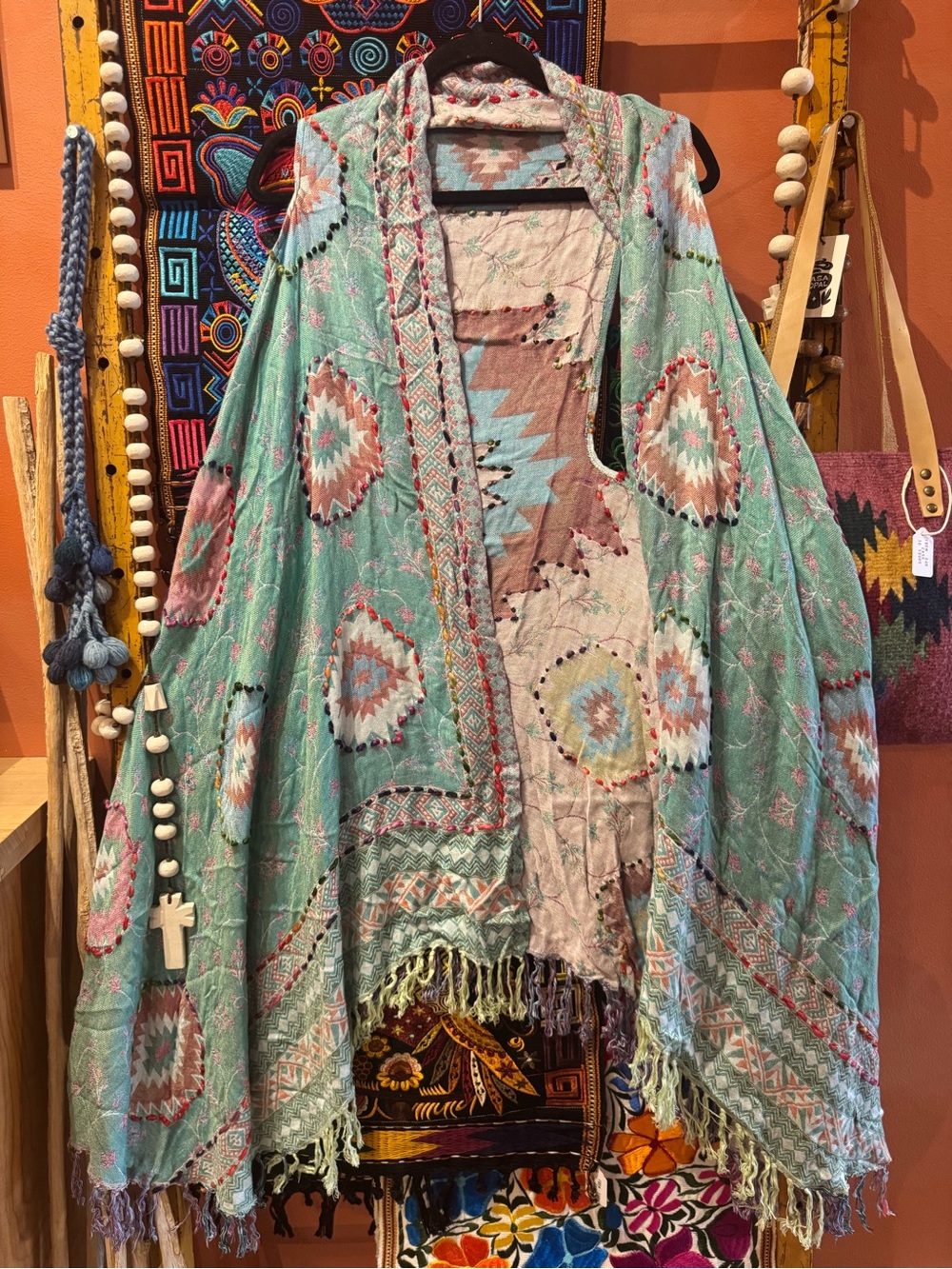Multi-colored geometric floral embroidery kimono on 100% rayon fabric. OS.